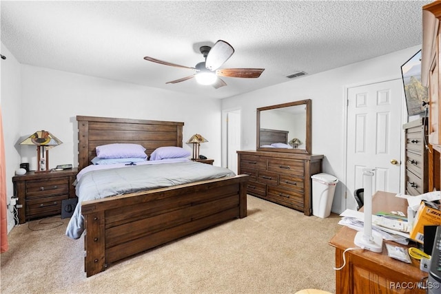 3085 Greynolds Ave, Spring Hill, FL 34608 - bedroom featuring light colored carpet, ceiling fan, and a textured ceiling