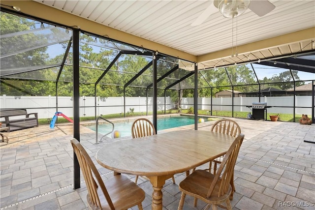 3085 Greynolds Ave, Spring Hill, FL 34608 - fenced backyard featuring a patio, glass enclosure, and a ceiling fan