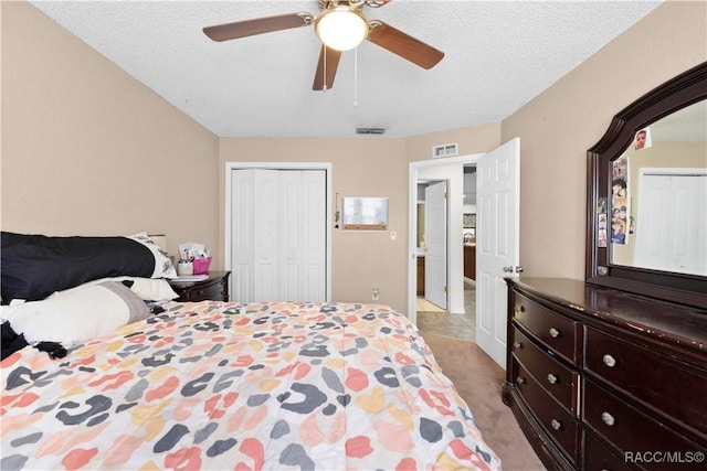 3085 Greynolds Ave, Spring Hill, FL 34608 - bedroom with a closet, carpet floors, a ceiling fan, and a textured ceiling
