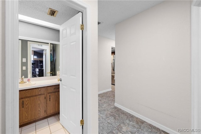 3085 Greynolds Ave, Spring Hill, FL 34608 - bathroom with vanity and tile patterned flooring