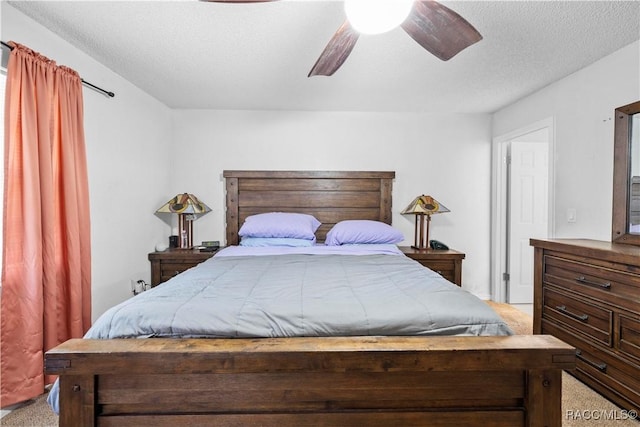 3085 Greynolds Ave, Spring Hill, FL 34608 - bedroom with light carpet, a ceiling fan, and a textured ceiling