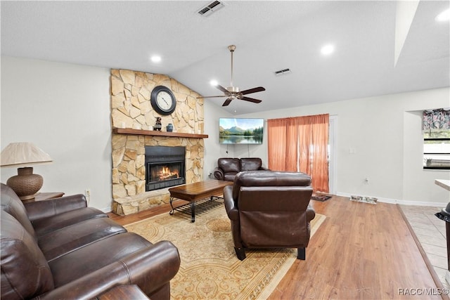 3085 Greynolds Ave, Spring Hill, FL 34608 - living room featuring lofted ceiling, a stone fireplace, a ceiling fan, wood finished floors, and recessed lighting