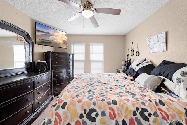 3085 Greynolds Ave, Spring Hill, FL 34608 - carpeted bedroom featuring a textured ceiling and a ceiling fan