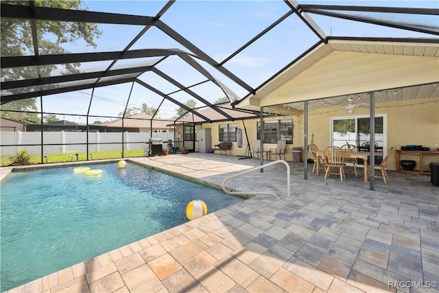 3085 Greynolds Ave, Spring Hill, FL 34608 - view of pool featuring a patio area, glass enclosure, and outdoor dining space