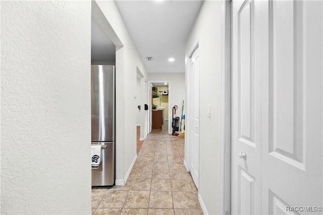 3085 Greynolds Ave, Spring Hill, FL 34608 - hallway with light tile patterned flooring and recessed lighting