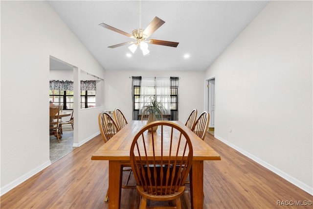 3085 Greynolds Ave, Spring Hill, FL 34608 - dining space with lofted ceiling, plenty of natural light, wood finished floors, ceiling fan, and recessed lighting