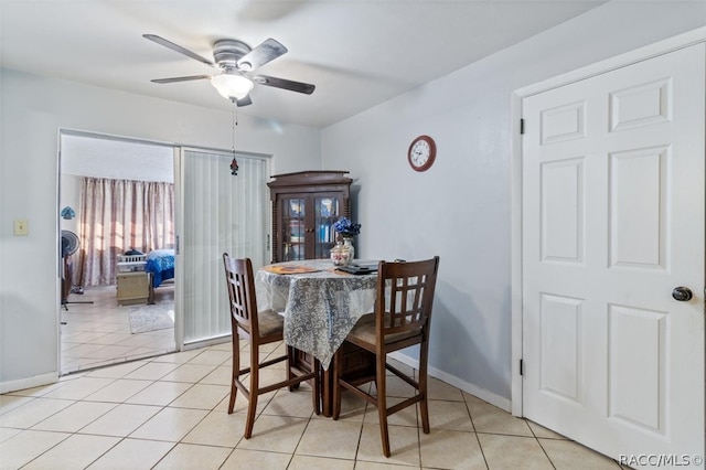 dining room with ceiling fan and light tile patterned flooring