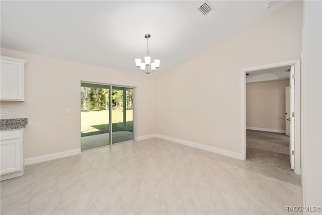 unfurnished dining area with vaulted ceiling and an inviting chandelier