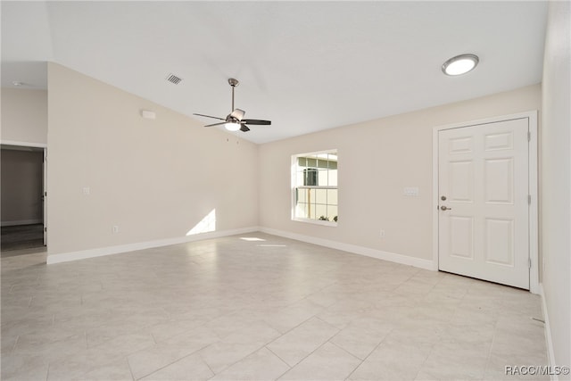 unfurnished room featuring lofted ceiling and ceiling fan