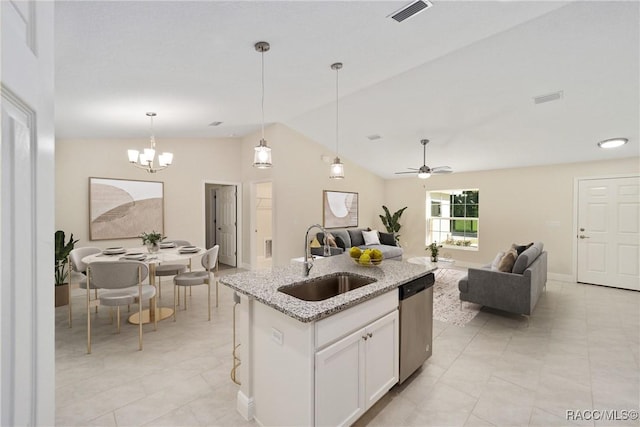 kitchen featuring decorative light fixtures, white cabinetry, dishwasher, sink, and a kitchen island with sink