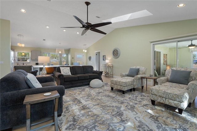 living room with vaulted ceiling and ceiling fan