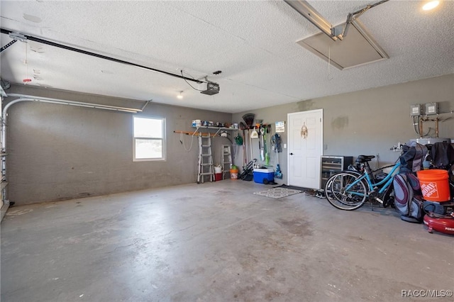 garage featuring a garage door opener