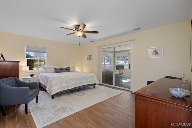 bedroom featuring access to outside and ceiling fan