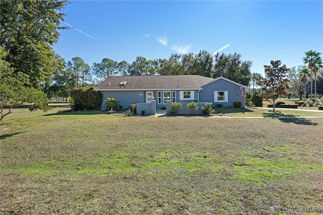 ranch-style home with a front yard