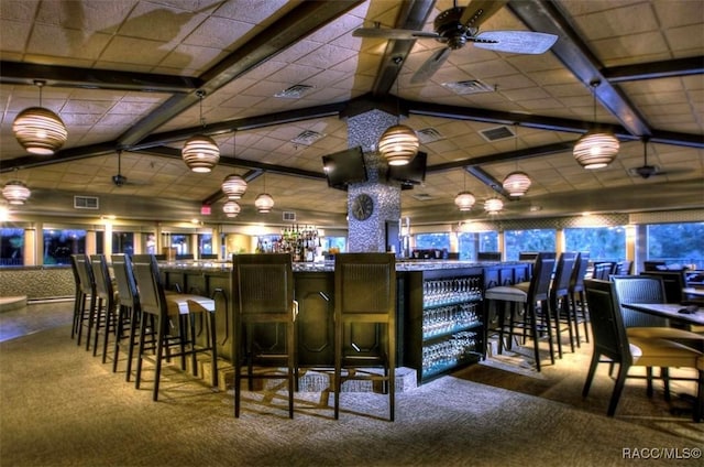 bar featuring ceiling fan and lofted ceiling