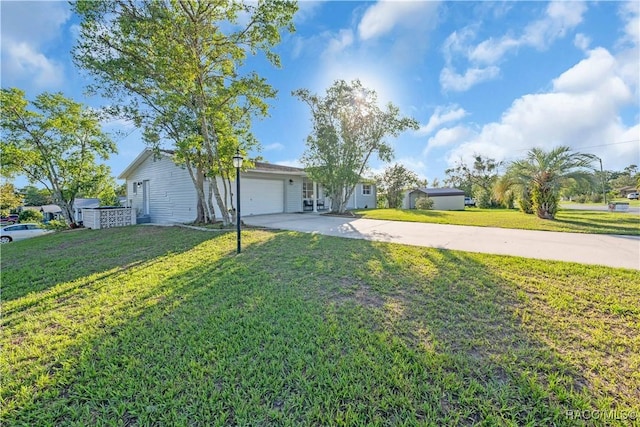 28 Truman Blvd, Beverly Hills, FL 34465 - ranch-style house featuring driveway, an attached garage, and a front yard