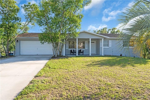 28 Truman Blvd, Beverly Hills, FL 34465 - ranch-style house featuring an attached garage, covered porch, concrete driveway, and a front lawn