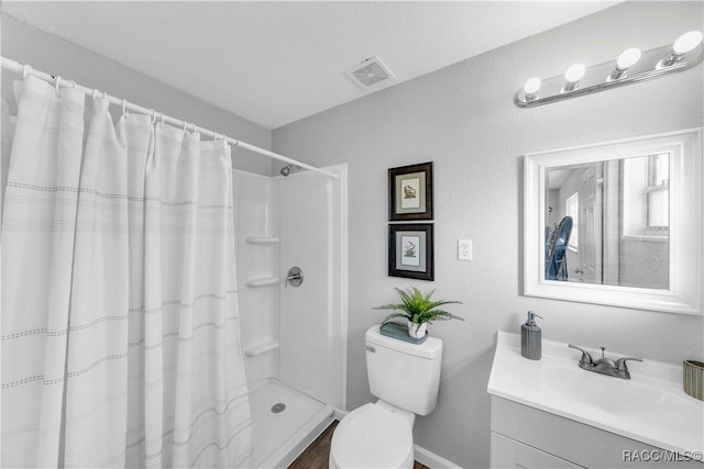 28 Truman Blvd, Beverly Hills, FL 34465 - full bathroom with vanity, toilet, a shower with curtain, baseboards, and wood finished floors