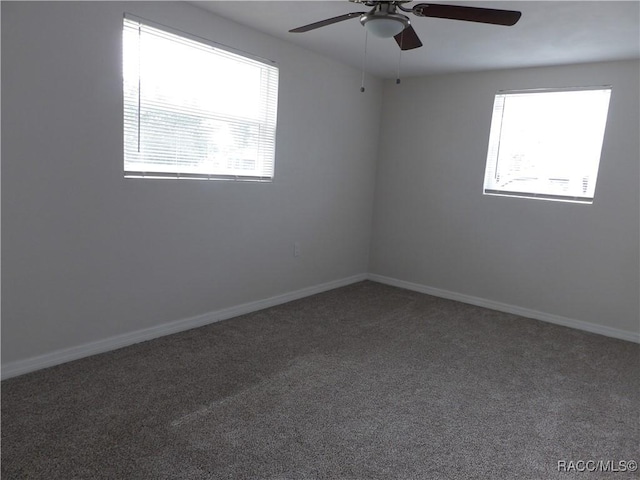 carpeted empty room with ceiling fan