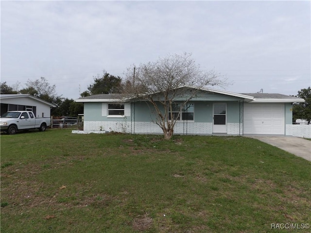 ranch-style house with a front yard and a garage