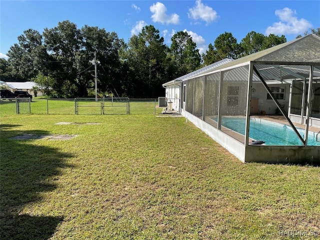 view of yard featuring a lanai and a fenced in pool