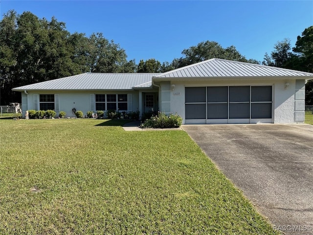 ranch-style house with a front lawn and a garage