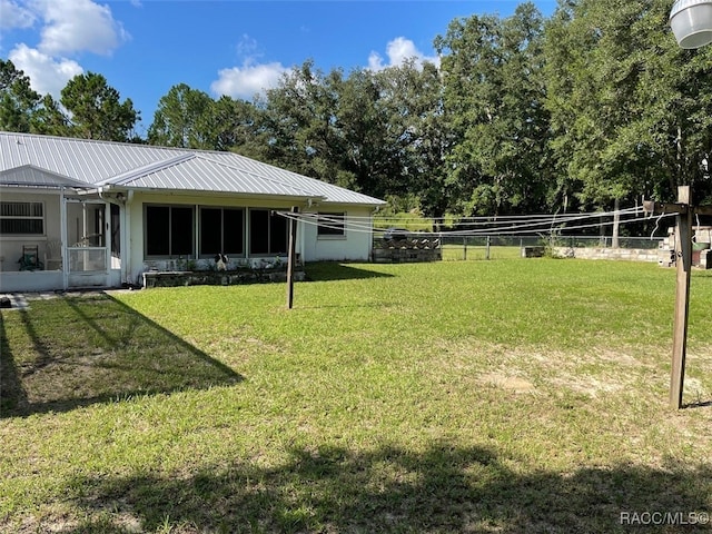 view of yard featuring a sunroom