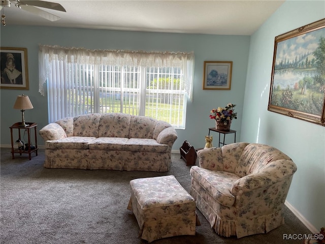 living room with ceiling fan and carpet floors