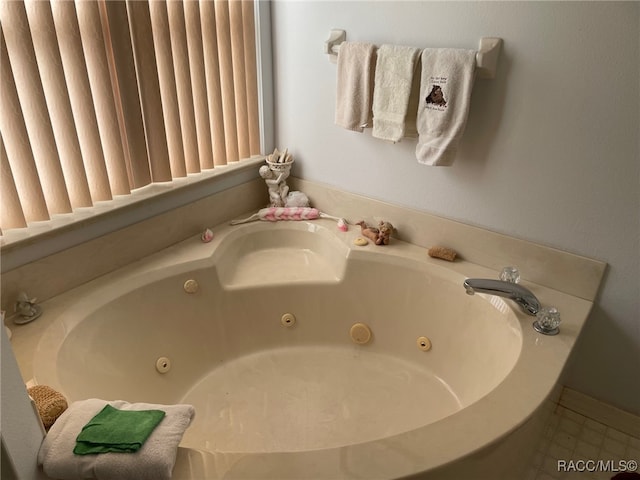 bathroom featuring tile patterned floors and a bathing tub