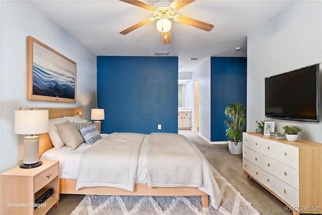 bedroom with carpet floors, visible vents, ceiling fan, and baseboards