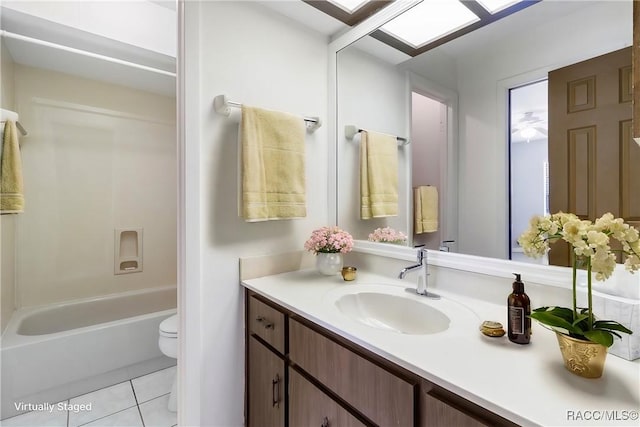 full bath featuring toilet, bathtub / shower combination, vanity, and tile patterned floors