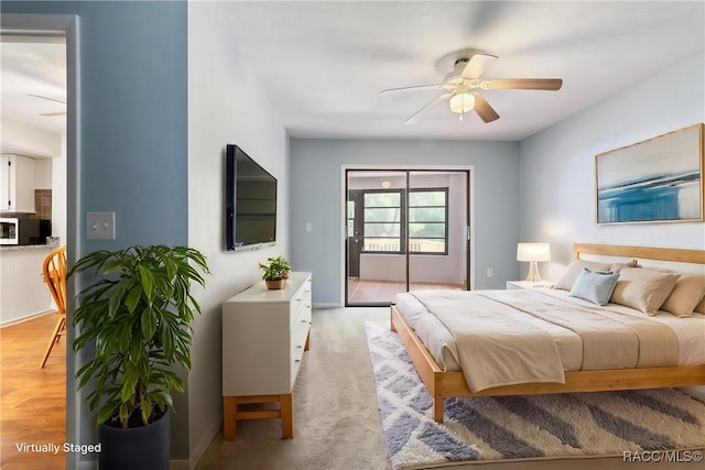 bedroom with ceiling fan and light wood finished floors