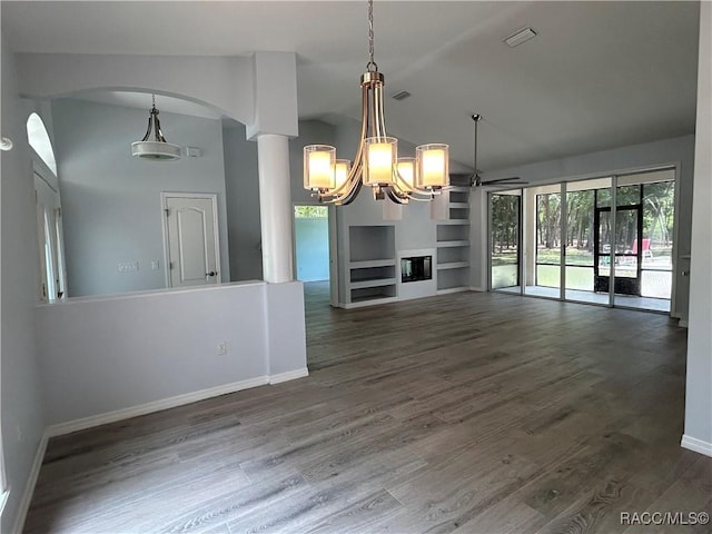 5774 N Lamp Post Dr, Beverly Hills, FL 34465 - unfurnished living room with a chandelier, wood finished floors, built in shelves, a ceiling fan, and arched walkways