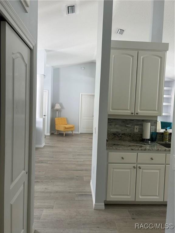 5774 N Lamp Post Dr, Beverly Hills, FL 34465 - hall with light wood-style flooring and baseboards