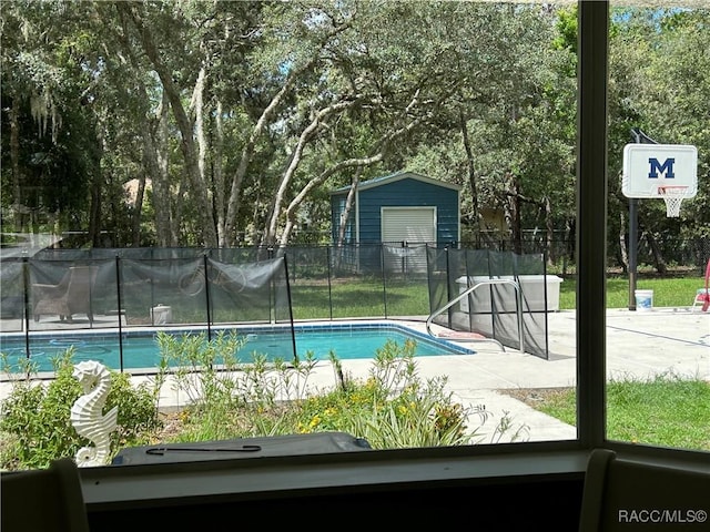 5774 N Lamp Post Dr, Beverly Hills, FL 34465 - view of pool featuring a shed and view of scattered trees