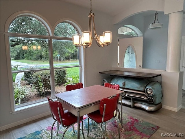 5774 N Lamp Post Dr, Beverly Hills, FL 34465 - dining room featuring a chandelier and wood finished floors