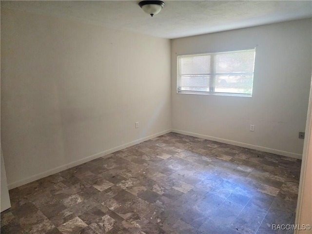 1408/1410 NE 15th Pl, Ocala, FL 34470 - unfurnished room with baseboards