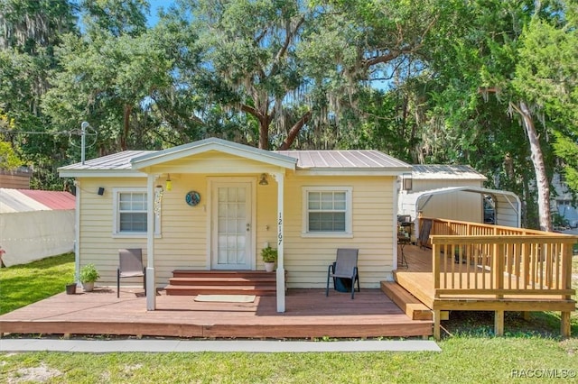 rear view of house with a deck