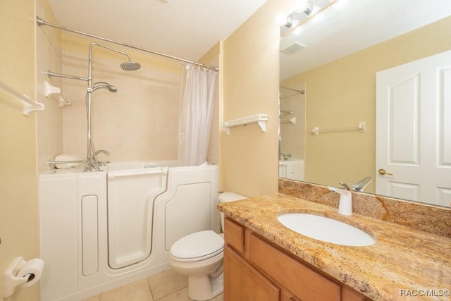 bathroom featuring toilet, shower / bathtub combination with curtain, tile patterned flooring, and vanity