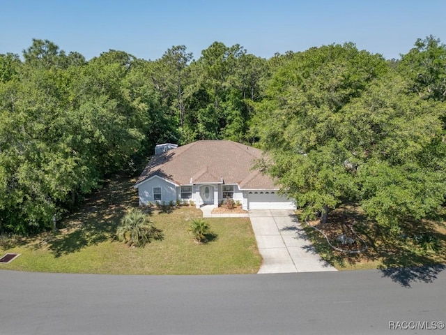 birds eye view of property with a forest view