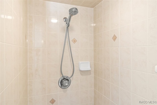 bathroom with tiled shower