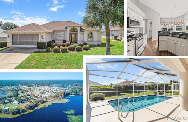 view of pool with an outdoor kitchen, a water view, sink, a lanai, and a yard