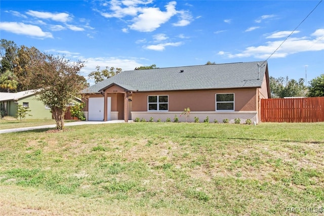 ranch-style house with a garage and a front yard