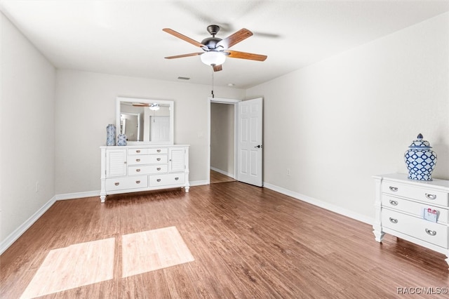 unfurnished bedroom featuring ceiling fan and wood-type flooring