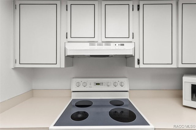 732 Wharton Ter, Inverness, FL 34450 - kitchen featuring exhaust hood, white appliances, light countertops, and white cabinetry