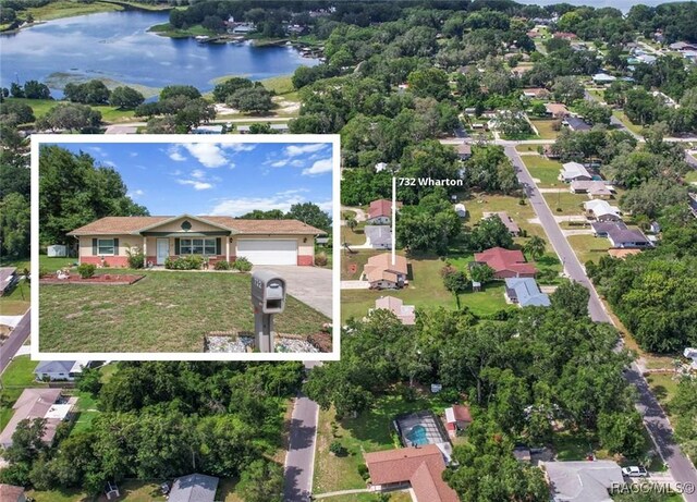 732 Wharton Ter, Inverness, FL 34450 - aerial overview of property's location with a large body of water and property boundaries highlighted