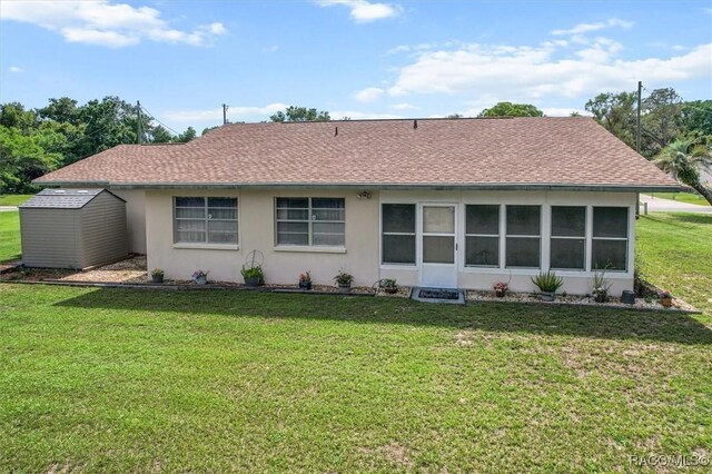 732 Wharton Ter, Inverness, FL 34450 - rear view of property with a yard, stucco siding, and roof with shingles