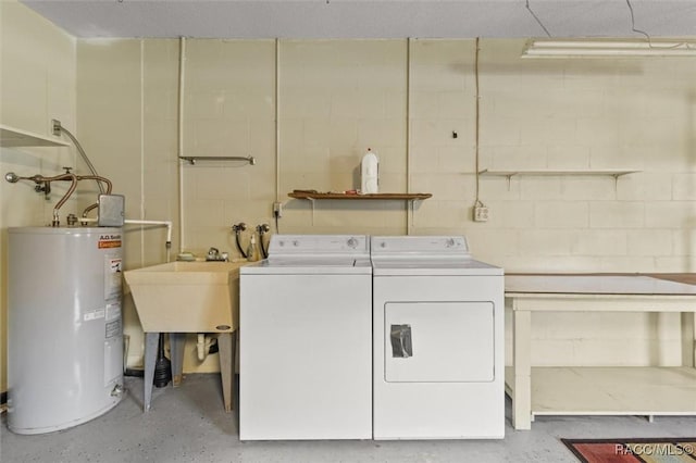 732 Wharton Ter, Inverness, FL 34450 - laundry area with water heater, concrete block wall, and washer and dryer