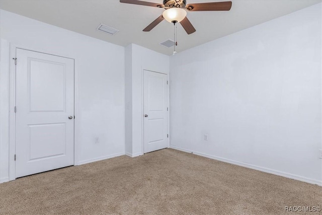 483 W Runyon Loop, Beverly Hills, FL 34465 - unfurnished bedroom with light colored carpet, baseboards, and a ceiling fan