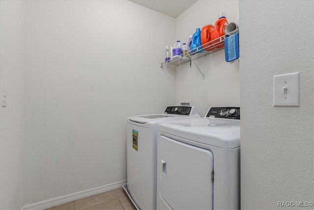 483 W Runyon Loop, Beverly Hills, FL 34465 - laundry room featuring independent washer and dryer, light tile patterned flooring, and baseboards
